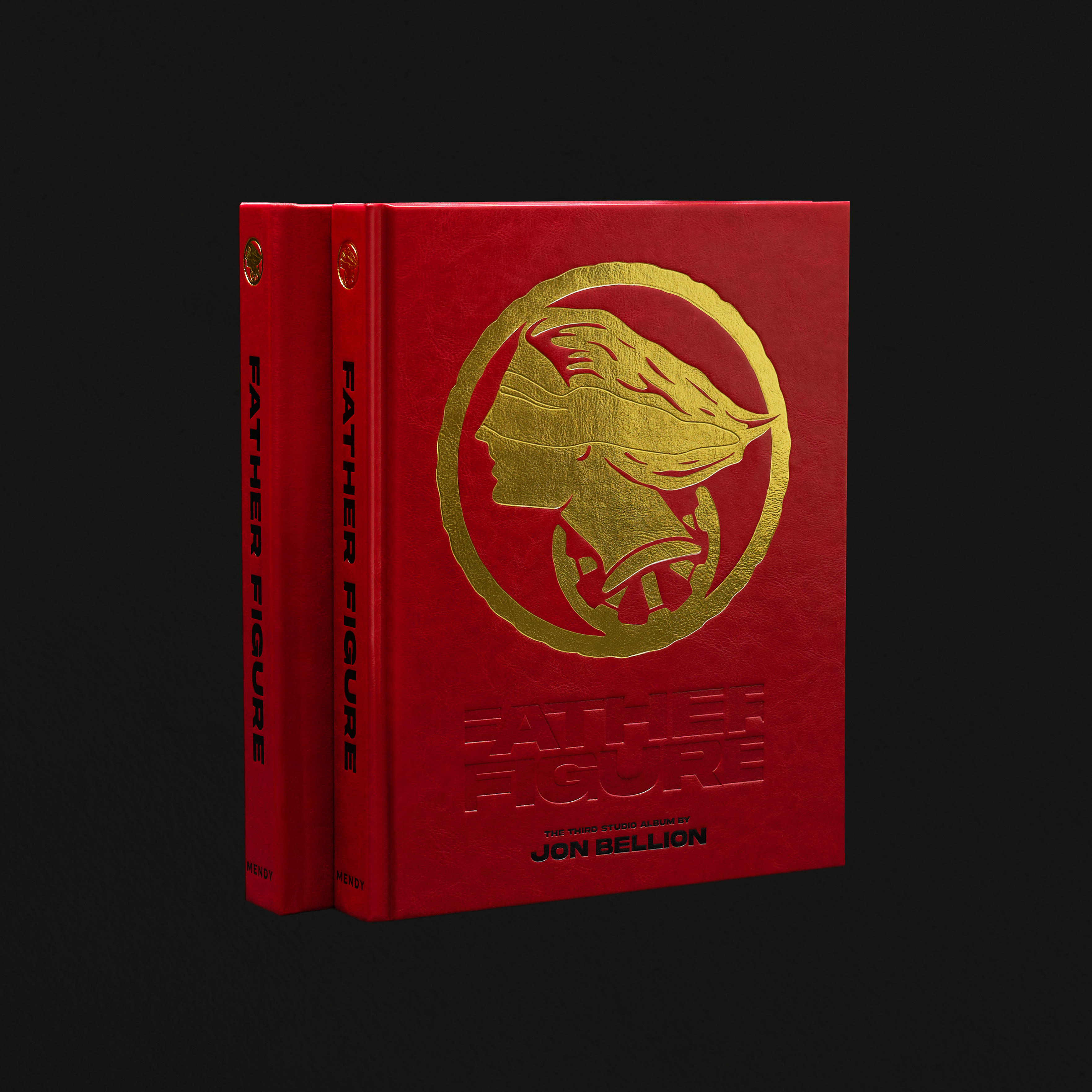 Father Figure: The Book Legacy Edition — includes First Edition and Legacy Edition hardcovers, red cover with gold debossed profile, a collaboration between Mendy and Jon Bellion